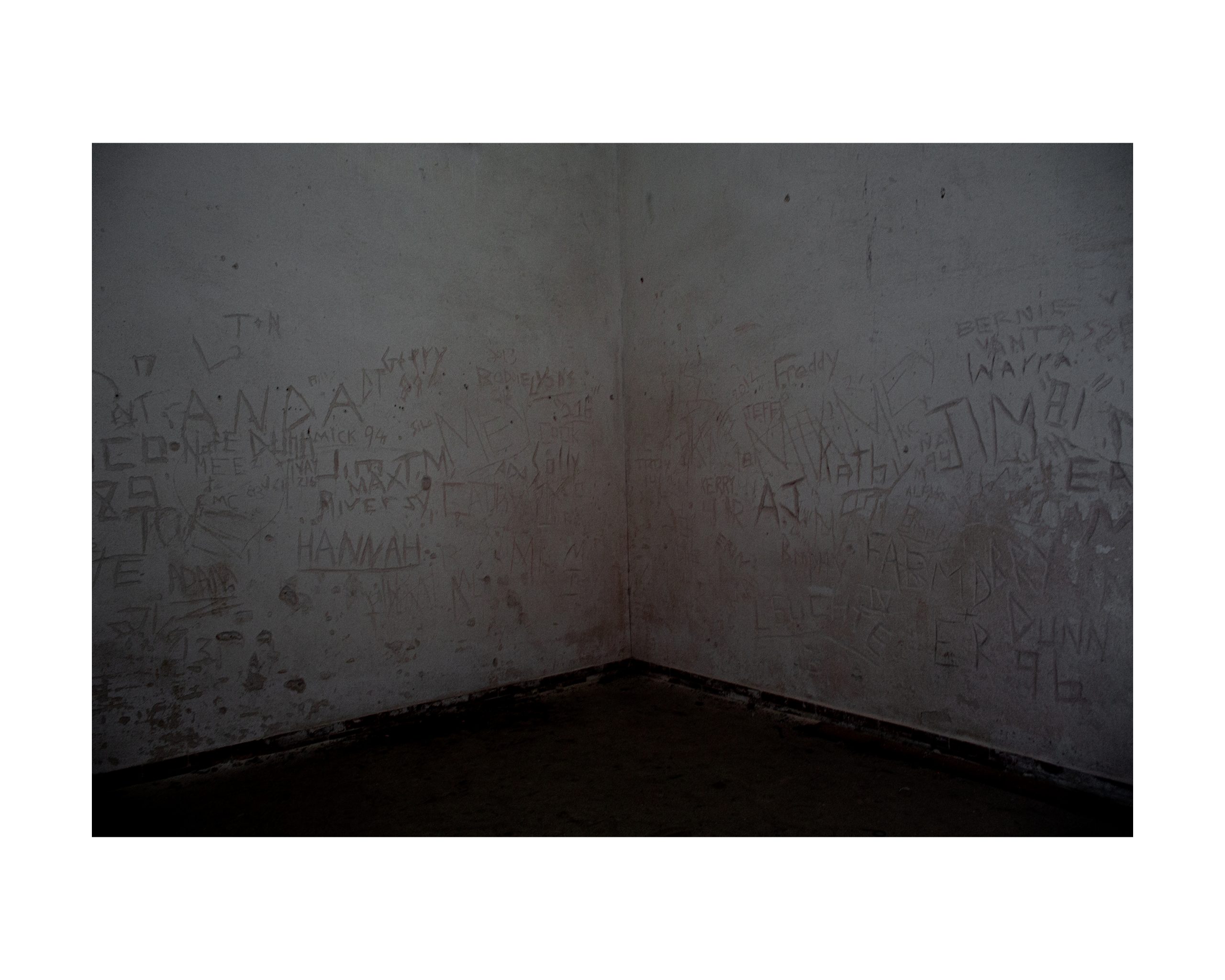 dark corner with writing on walls on georges island