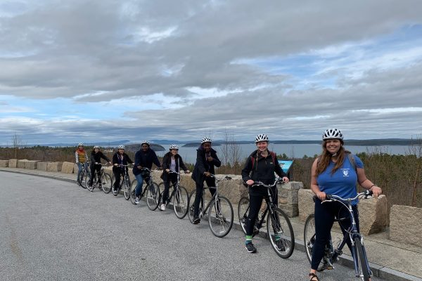 Spring 2019 PLACE Fellows and Leads on bicycles in a line